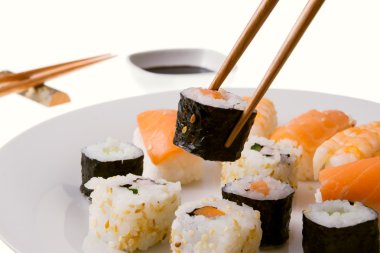 Picking up a sushi roll clipart