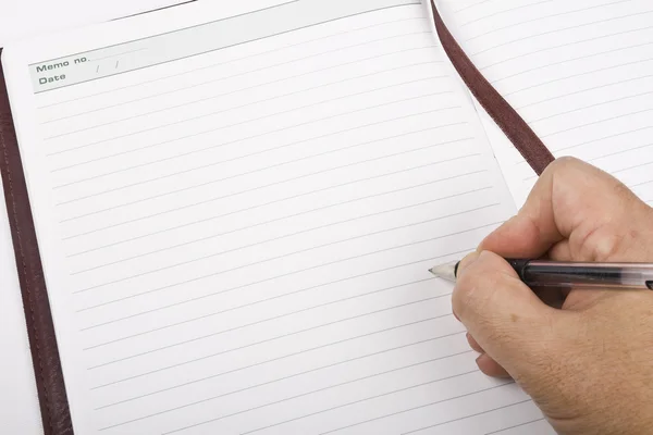 Hand writing on notepad — Stock Photo, Image