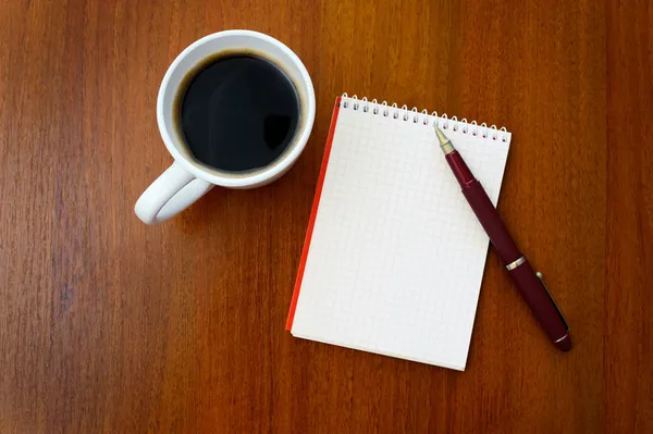 Μολύβι, καφέ, σημειωματάριο — Stockfoto