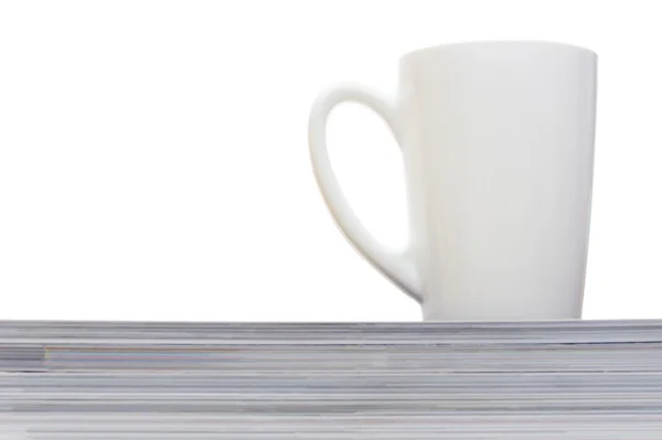 Cup and magazines — Stock Photo, Image